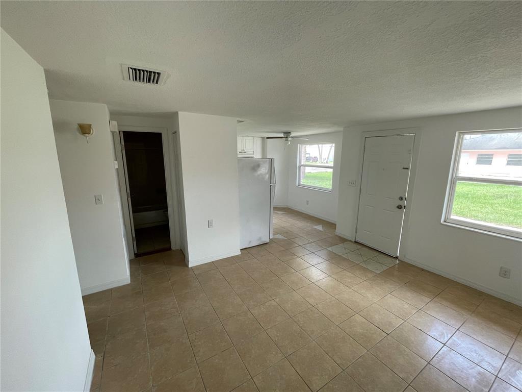 5317 Avery Road New Port Richey, FL 34652 - Photo 19 of 39 an empty room with windows and entrance