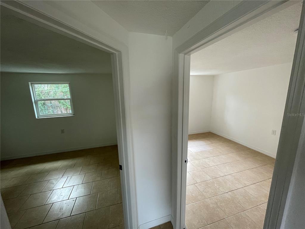 5317 Avery Road New Port Richey, FL 34652 - Photo 21 of 39 a view of an empty room with a window