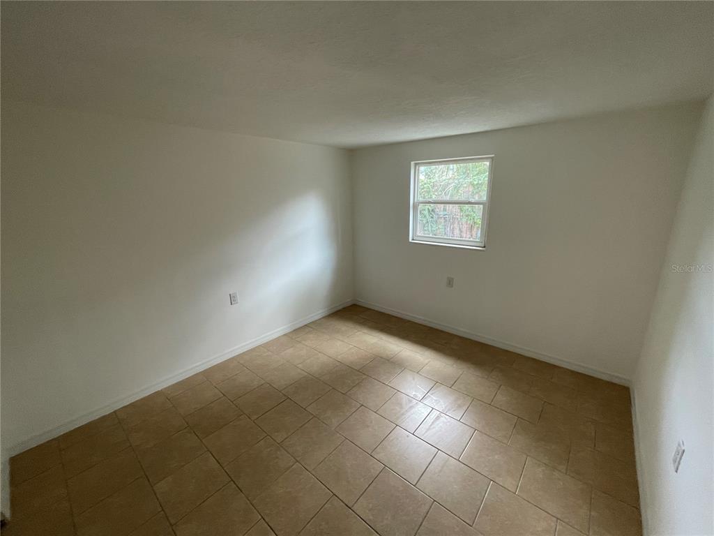 5317 Avery Road New Port Richey, FL 34652 - Photo 24 of 39 an empty room with a empty space and windows
