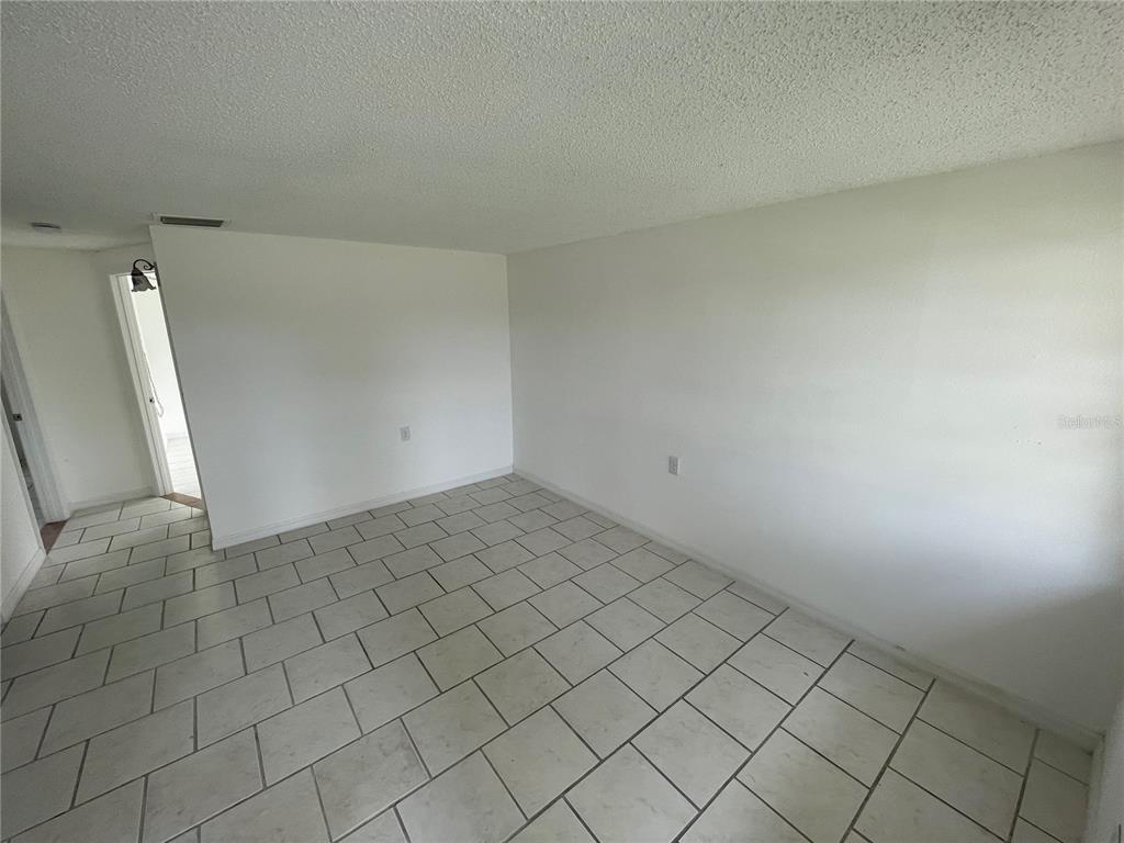 5317 Avery Road New Port Richey, FL 34652 - Photo 28 of 39 an empty room with windows