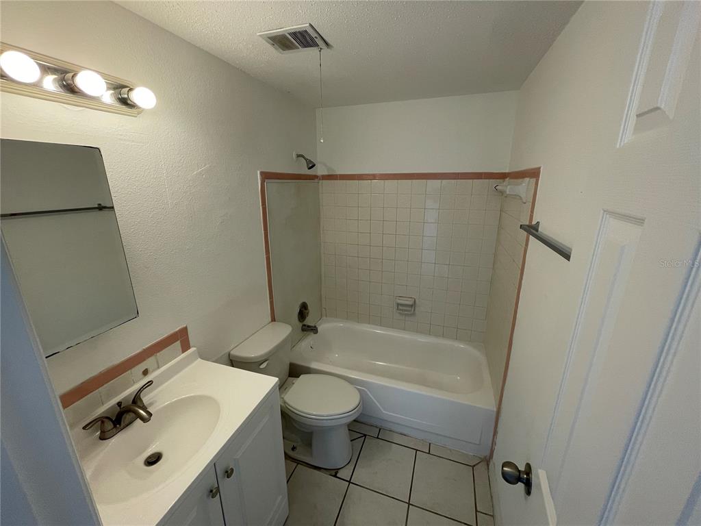 5317 Avery Road New Port Richey, FL 34652 - Photo 34 of 39 a bathroom with a sink toilet and shower