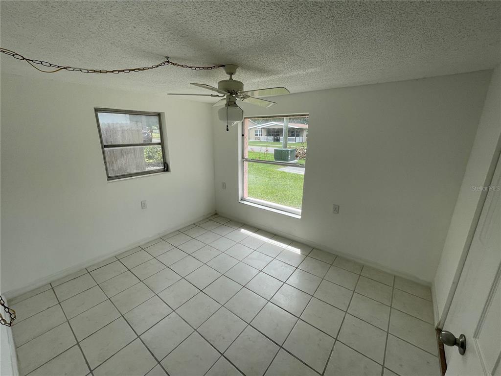 5317 Avery Road New Port Richey, FL 34652 - Photo 36 of 39 an empty room with windows and cabinet