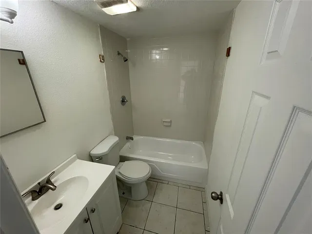 a view of an empty room and a window