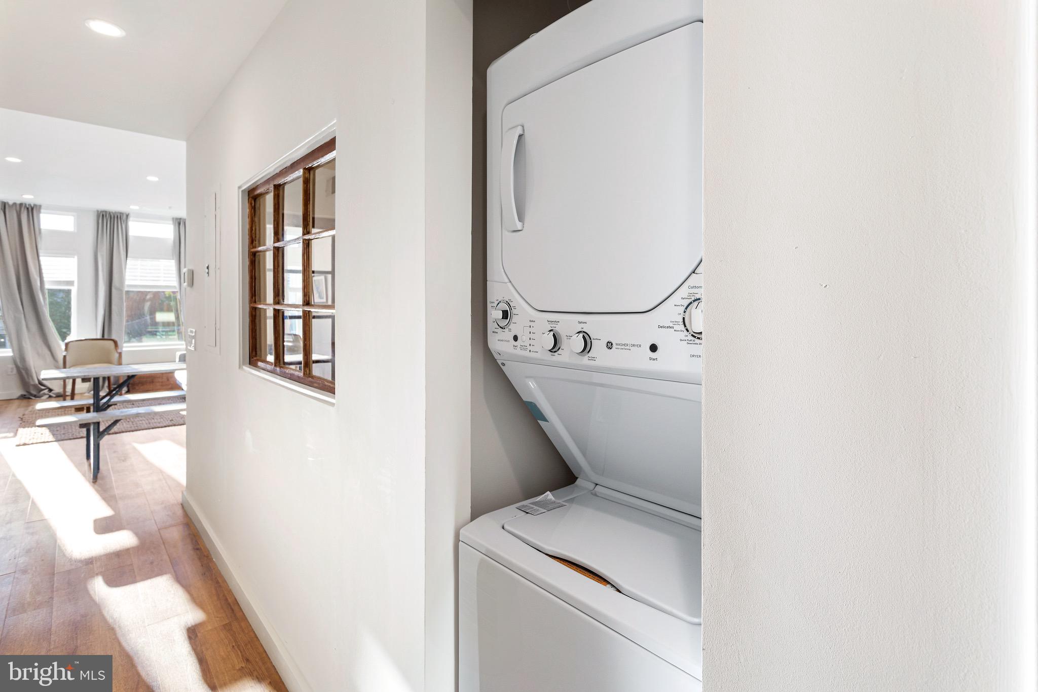 2465 18th Street Northwest, Unit 1 Washington, DC 20009 - Photo 16 of 17 a utility room with dryer and washer