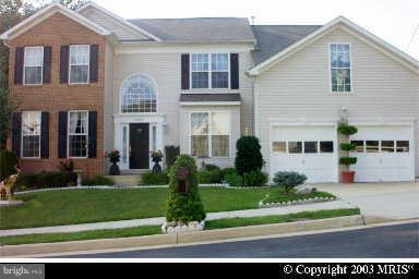 8706 Center Road Springfield, VA 22152 - Photo 1 of 1 a front view of a house with a yard
