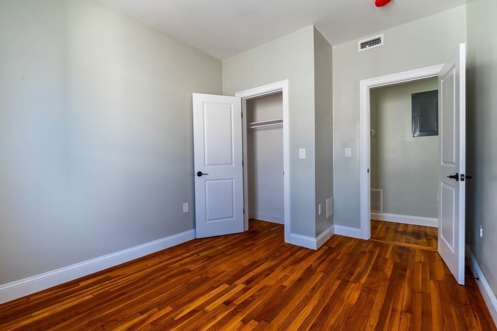 28-30 Chestnut Avenue, Unit 3 Boston, MA 02130 - Photo 13 of 17 a view of a room with wooden floor and white walls