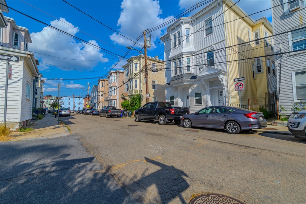 28-30 Chestnut Avenue, Unit 3 Boston, MA 02130 - Photo 15 of 17 a view of a city street with cars