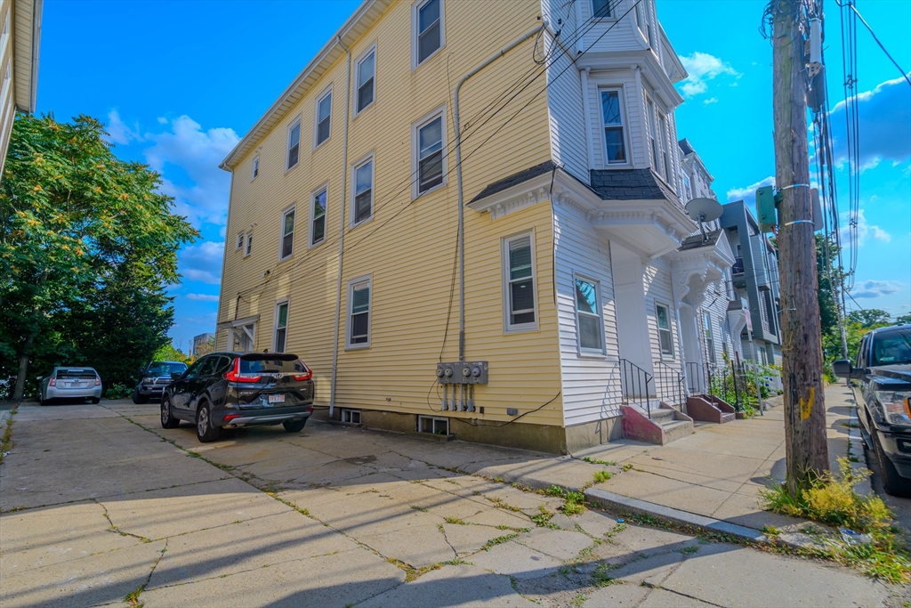 28-30 Chestnut Avenue, Unit 3 Boston, MA 02130 - Photo 16 of 17 a car parked in front of a building