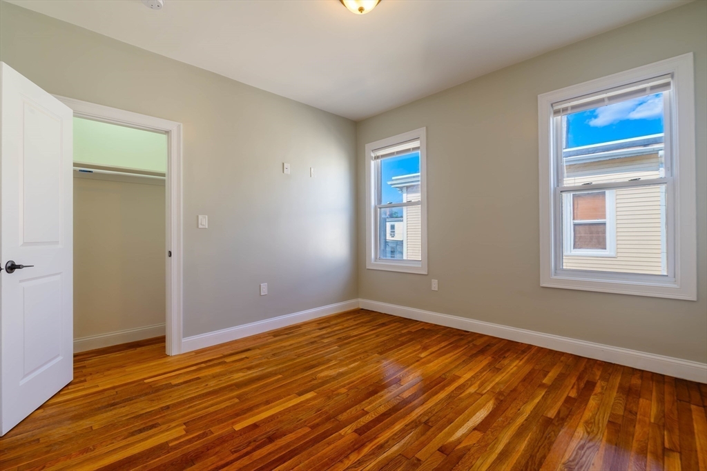 28-30 Chestnut Avenue, Unit 3 Boston, MA 02130 - Photo 7 of 17 a view of empty room with wooden floor and fan