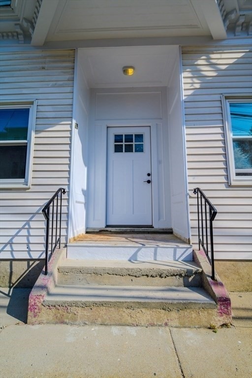 28-30 Chestnut Avenue, Unit 3 Boston, MA 02130 - Photo 9 of 17 a view of a house with a wooden fence