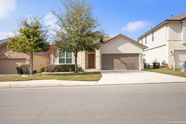 a house with a yard and a large parking space