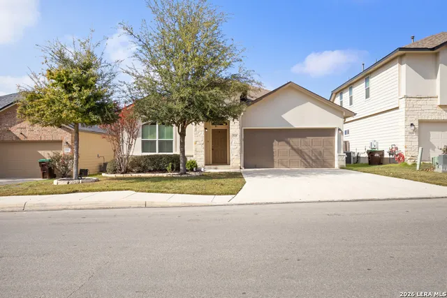 a house with a yard and a large parking space
