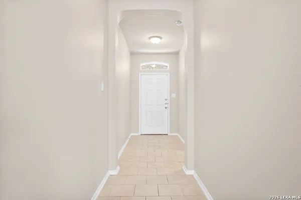 a view of a bathroom from a hallway