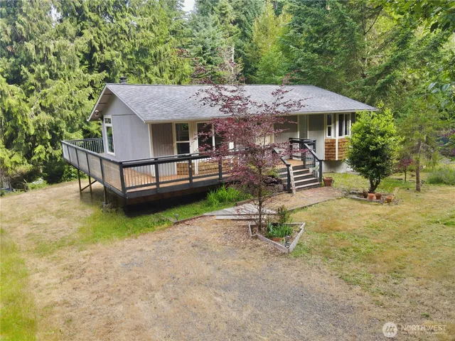 aerial view of a house with swimming pool and sitting area