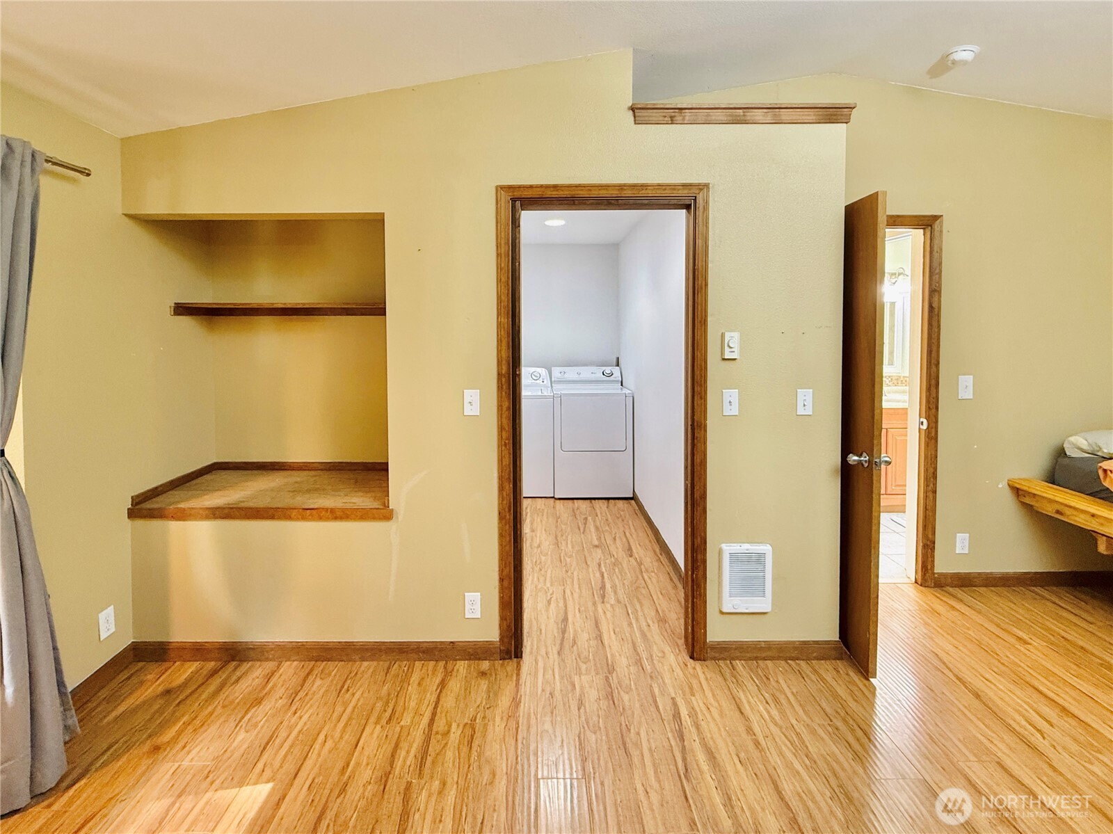 11422 Leschi Circle Anderson Island, WA 98303 - Photo 16 of 40 a view of a room with wooden floor and door