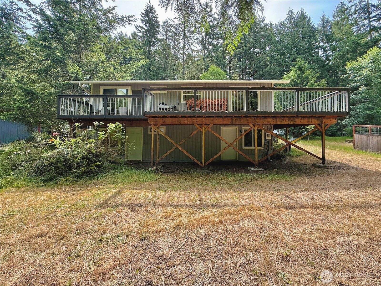 11422 Leschi Circle Anderson Island, WA 98303 - Photo 26 of 40 a view of a house with wooden fence