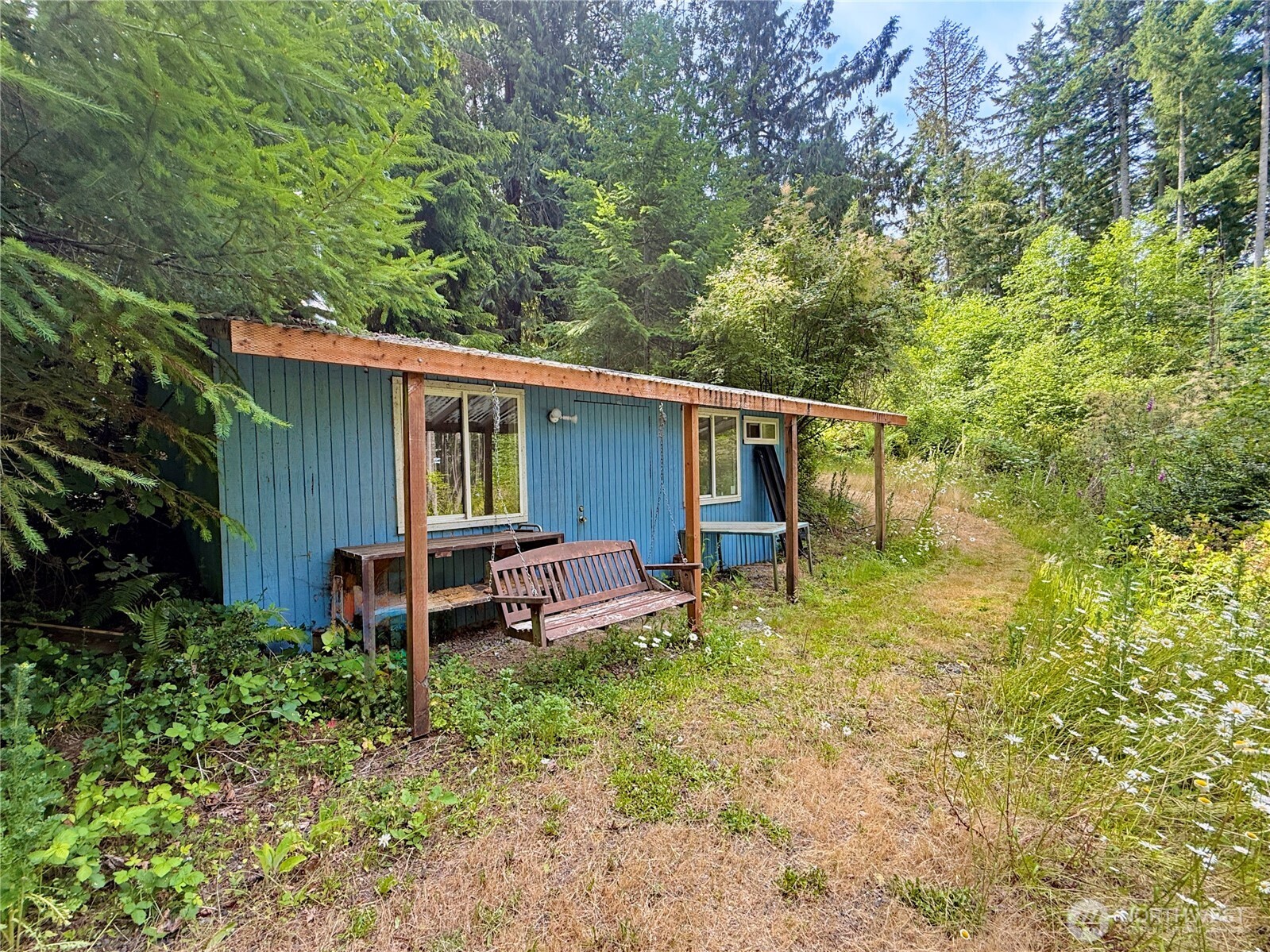 11422 Leschi Circle Anderson Island, WA 98303 - Photo 29 of 40 a backyard of a house with table and chairs
