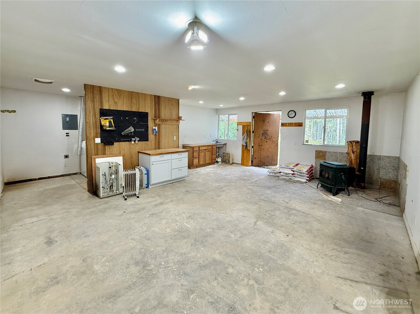 11422 Leschi Circle Anderson Island, WA 98303 - Photo 30 of 40 a view of a livingroom with furniture and a flat screen tv