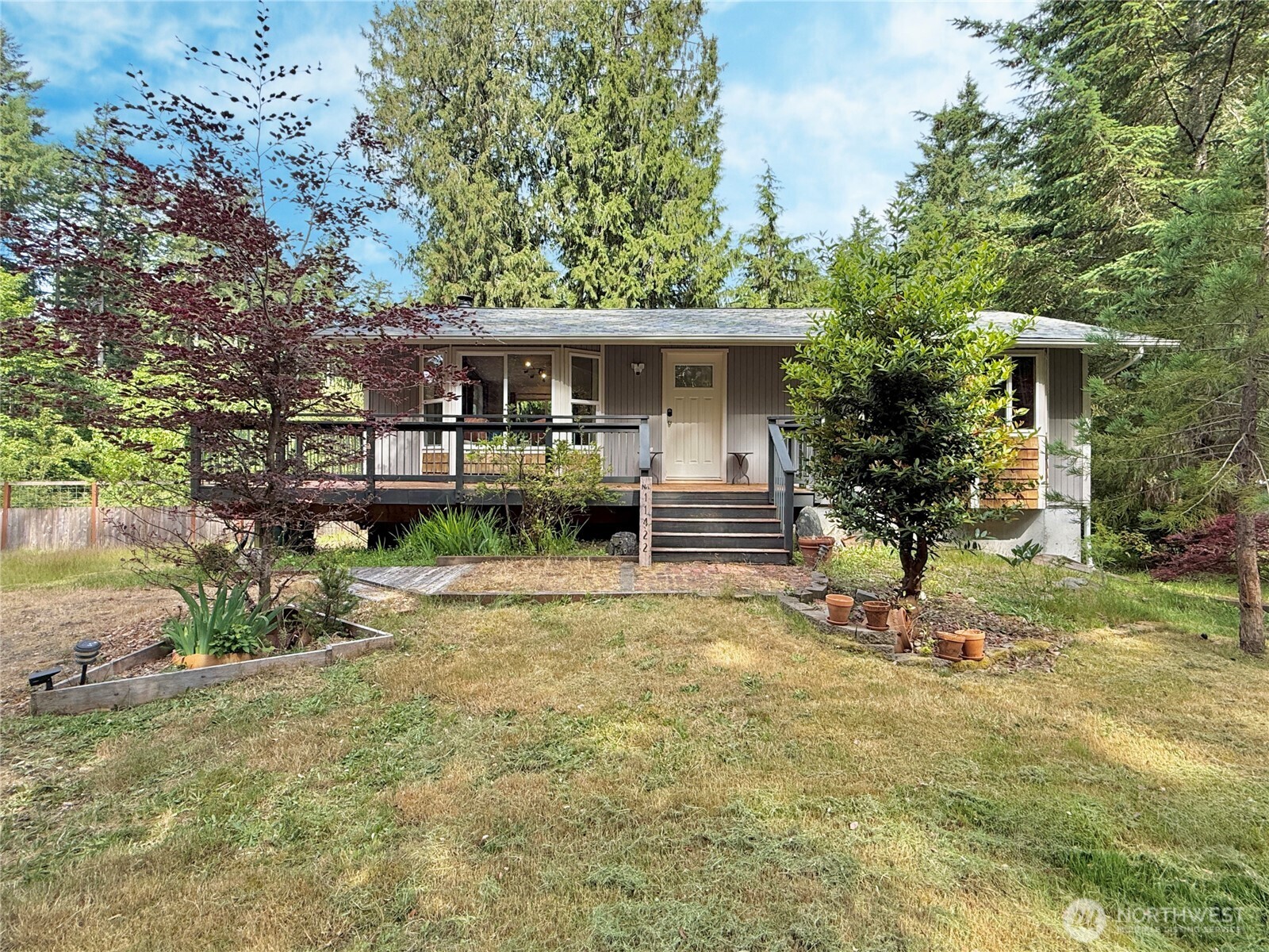 11422 Leschi Circle Anderson Island, WA 98303 - Photo 4 of 40 a view of a house with backyard and sitting area