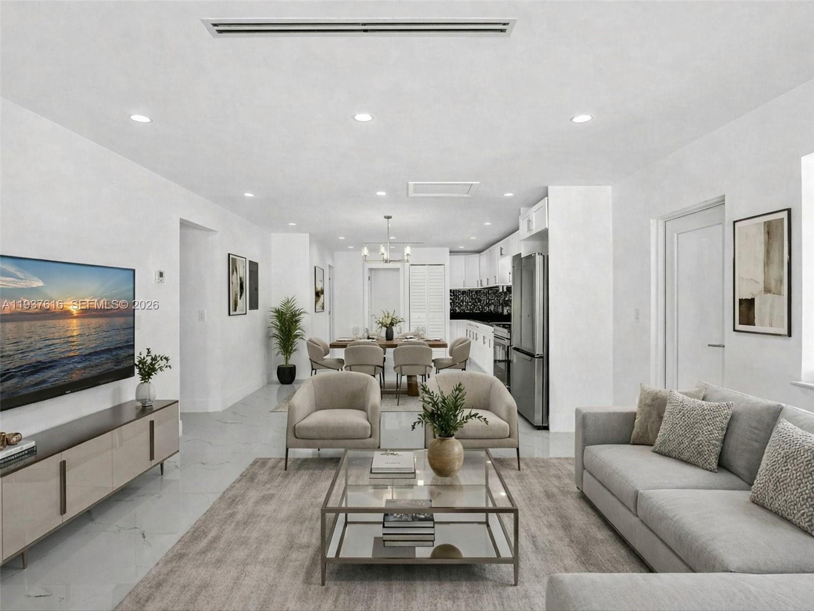 3354 Northwest 50th Street, Unit 3354 Miami, FL 33142 - Photo 2 of 26 a living room with furniture and a flat screen tv