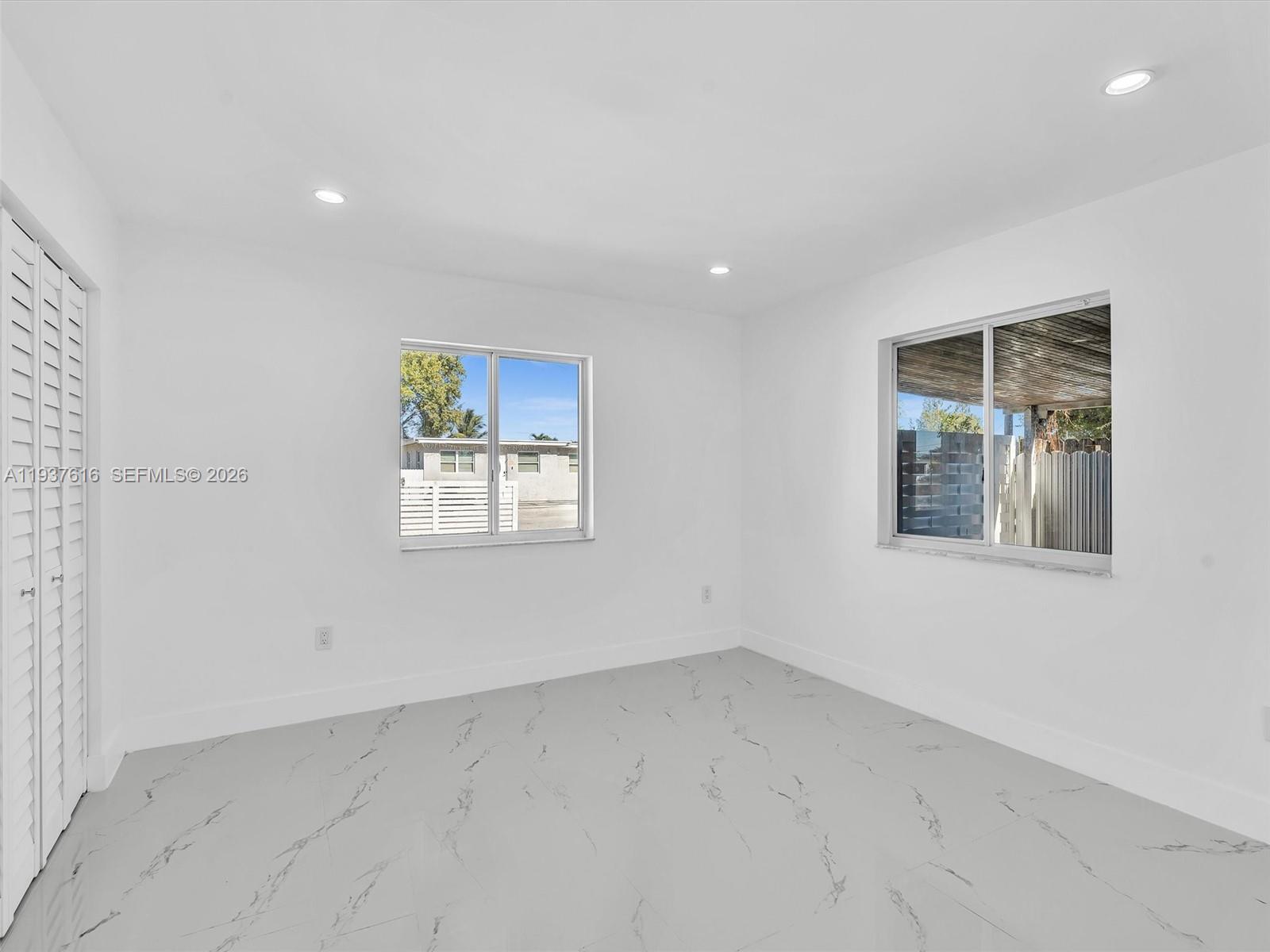 3354 Northwest 50th Street, Unit 3354 Miami, FL 33142 - Photo 21 of 26 an empty room with windows