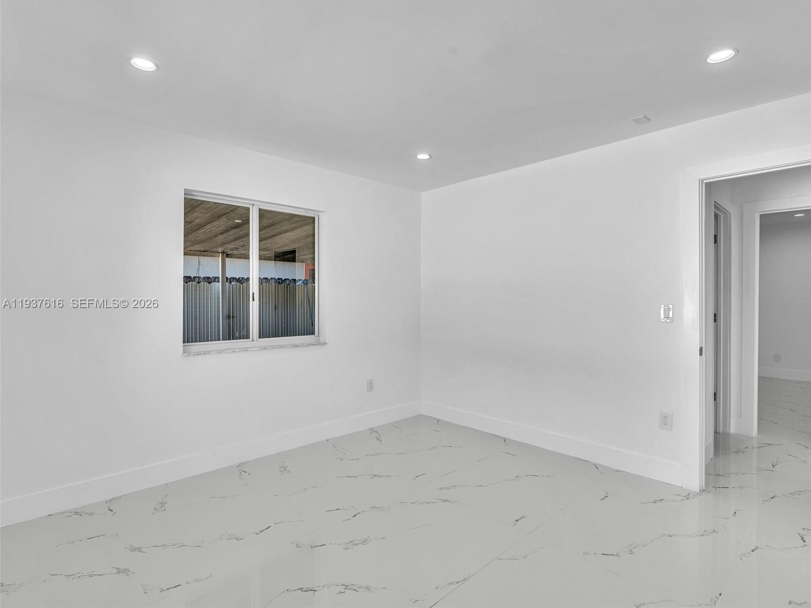 3354 Northwest 50th Street, Unit 3354 Miami, FL 33142 - Photo 22 of 26 an empty room with windows