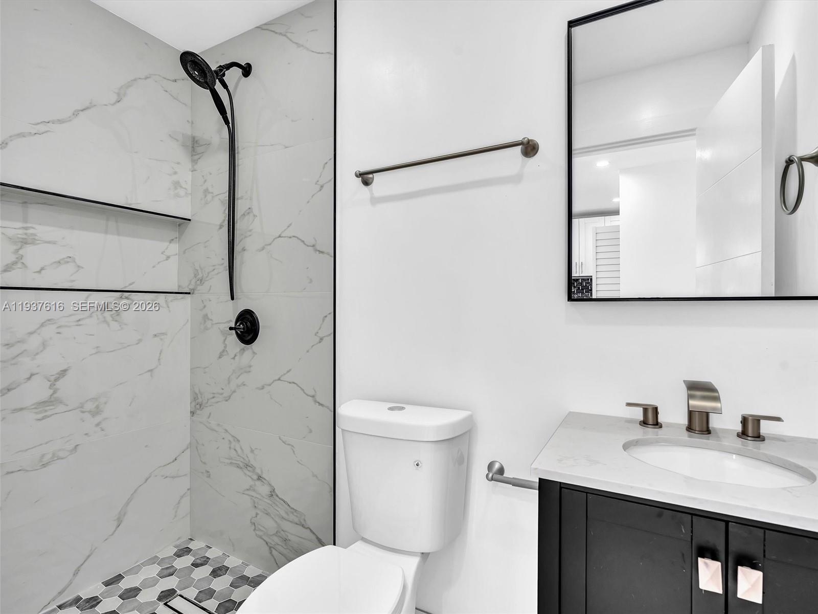 3354 Northwest 50th Street, Unit 3354 Miami, FL 33142 - Photo 23 of 26 a bathroom with a granite countertop sink toilet and shower