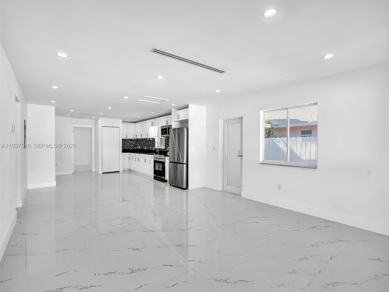 3354 Northwest 50th Street, Unit 3354 Miami, FL 33142 - Photo 5 of 26 a view of kitchen with stainless steel appliances refrigerator oven