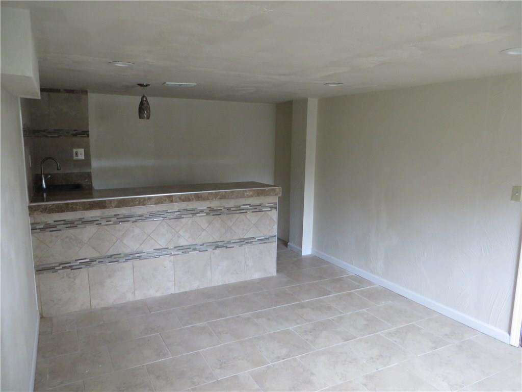137 Poplar Ridge Road Penn Hills, PA 15235 - Photo 13 of 25 Game room with ceramic floors and wetbar
