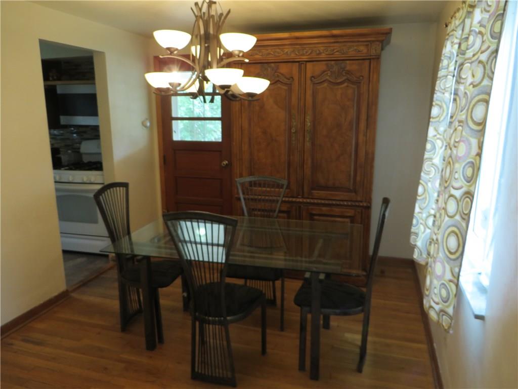 137 Poplar Ridge Road Penn Hills, PA 15235 - Photo 5 of 25 Dining room w/hardwood floors and door to side porch