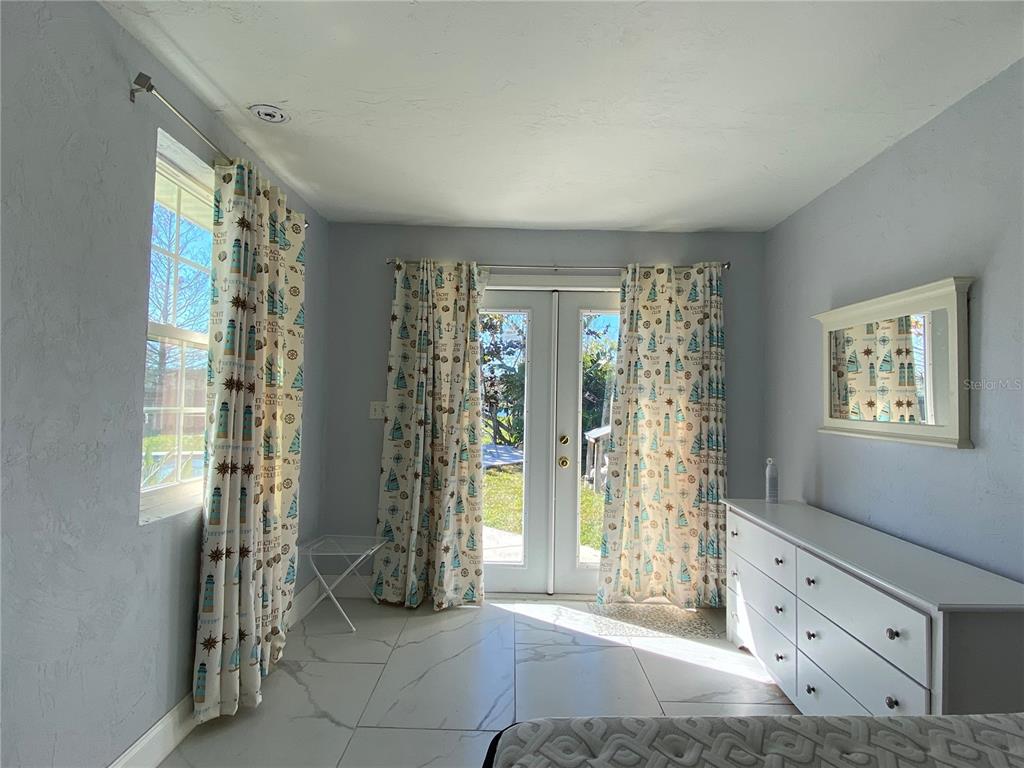 910 Lake Avenue Edgewater, FL 32132 - Photo 12 of 23 a view of livingroom with furniture and windows