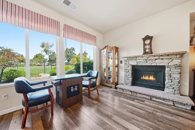 a bedroom with a bed dresser and a window