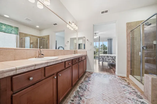 a bedroom with furniture and wooden floor