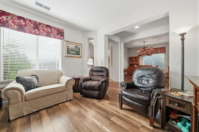a dining room with furniture and window