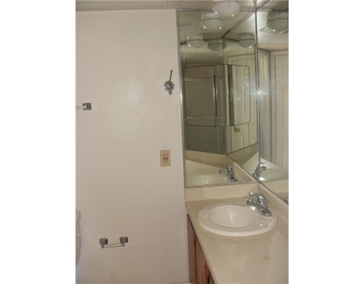 15010 Leeward Drive, Unit 107 Corpus Christi, TX 78418 - Photo 5 of 7 a bathroom with a sink toilet and shower