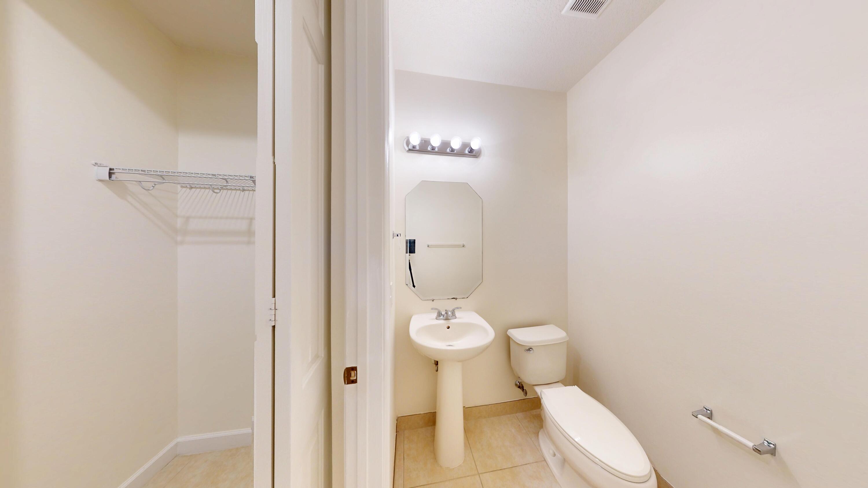 235 Chrystie Circle Delray Beach, FL 33484 - Photo 12 of 27 a bathroom with a toilet