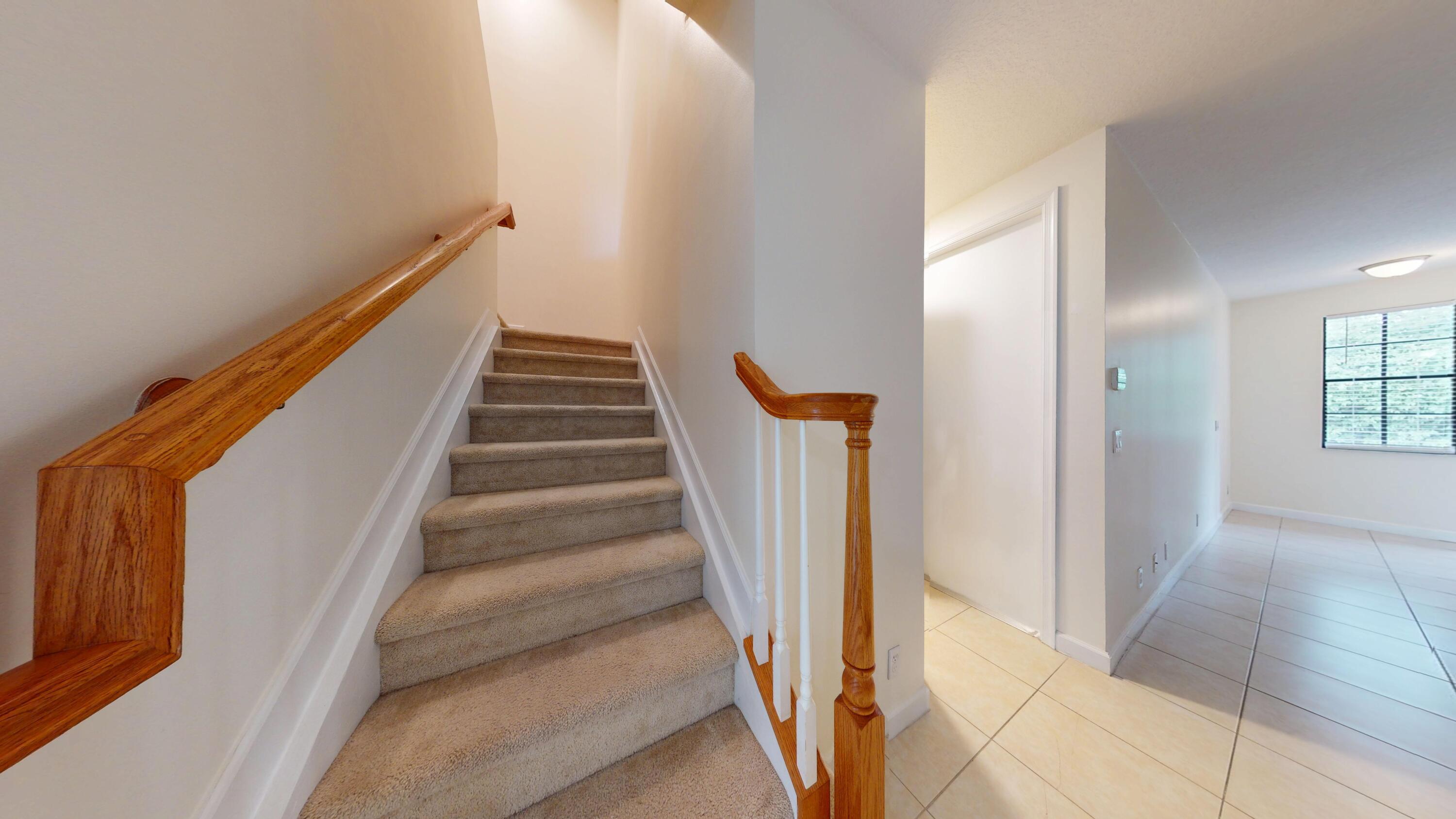 235 Chrystie Circle Delray Beach, FL 33484 - Photo 13 of 27 a view of entryway and hall with wooden floor
