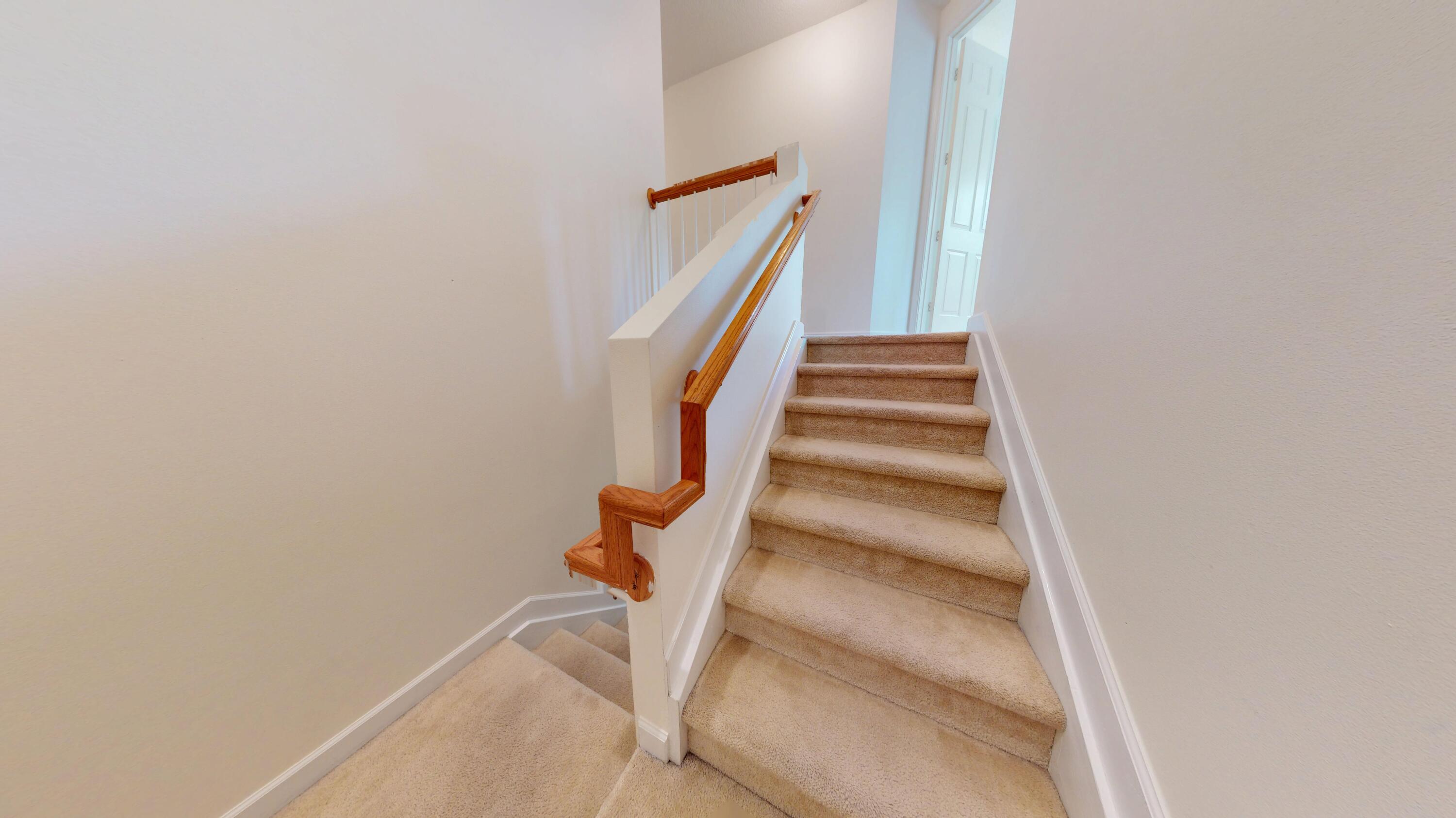 235 Chrystie Circle Delray Beach, FL 33484 - Photo 14 of 27 a view of staircase with wooden floor and white walls