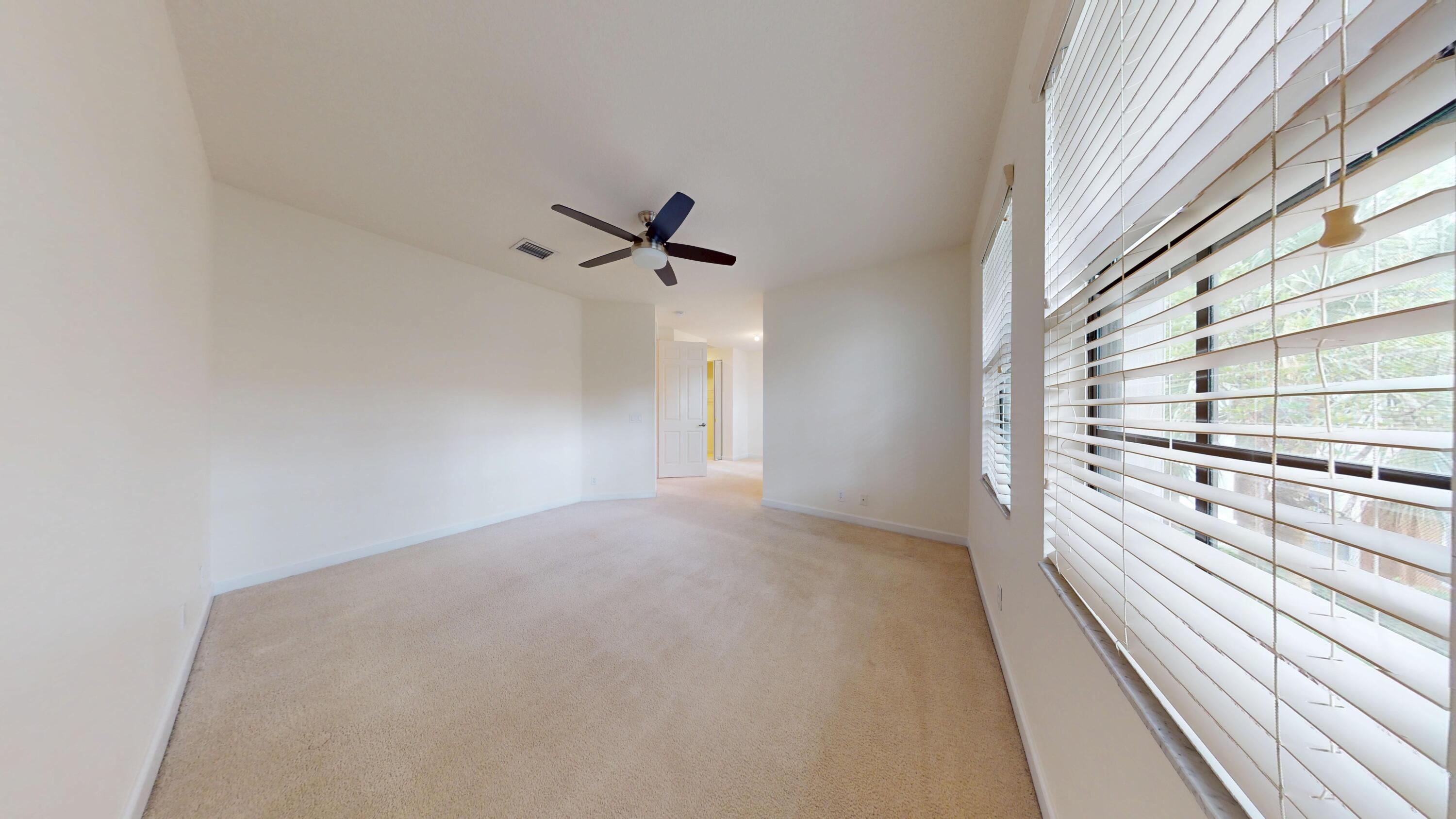 235 Chrystie Circle Delray Beach, FL 33484 - Photo 16 of 27 a view of a room with racks on the wall