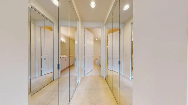 a spacious bathroom with a double vanity sink toilet and shower