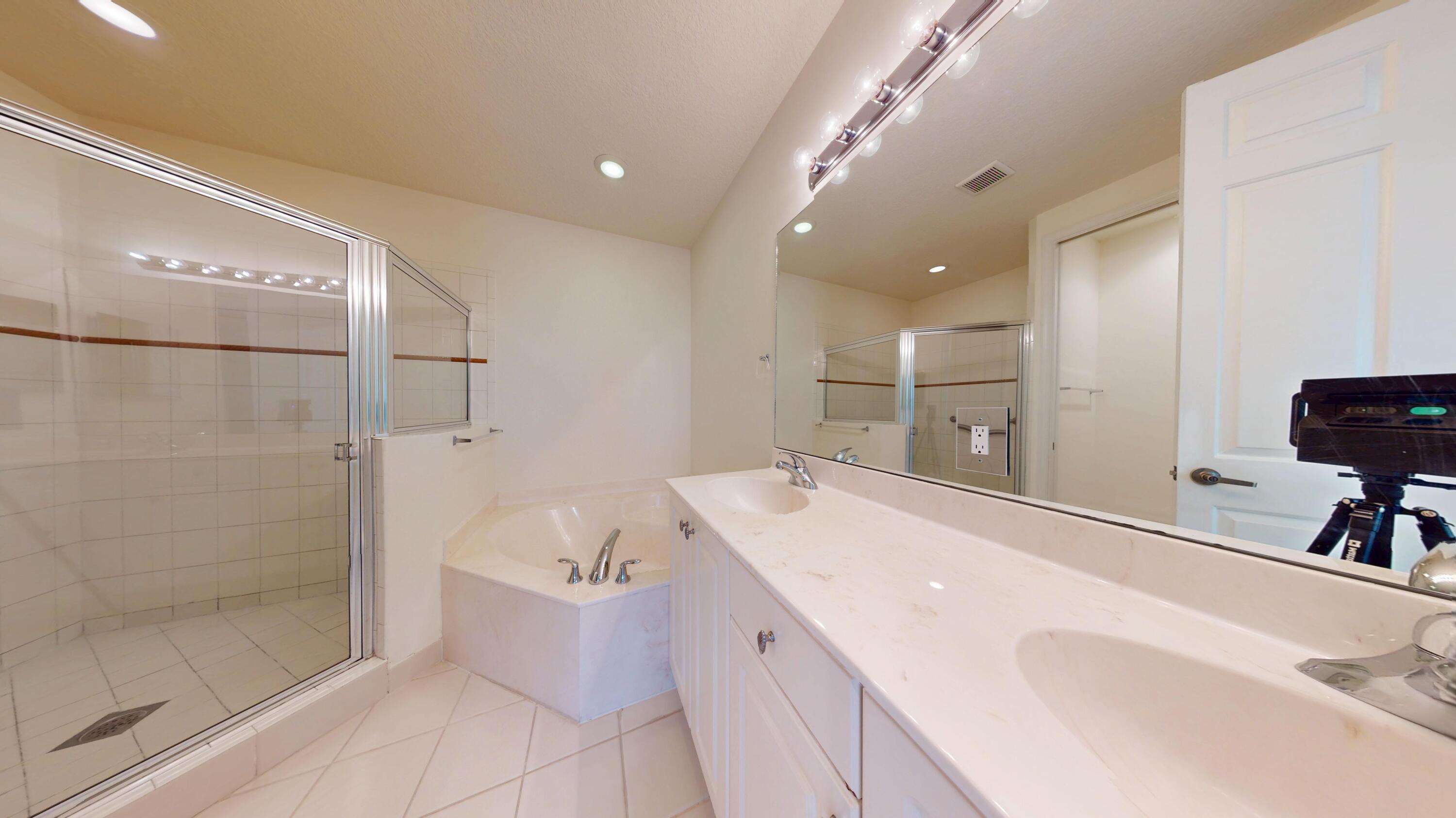 235 Chrystie Circle Delray Beach, FL 33484 - Photo 19 of 27 a bathroom with a sink a toilet and shower
