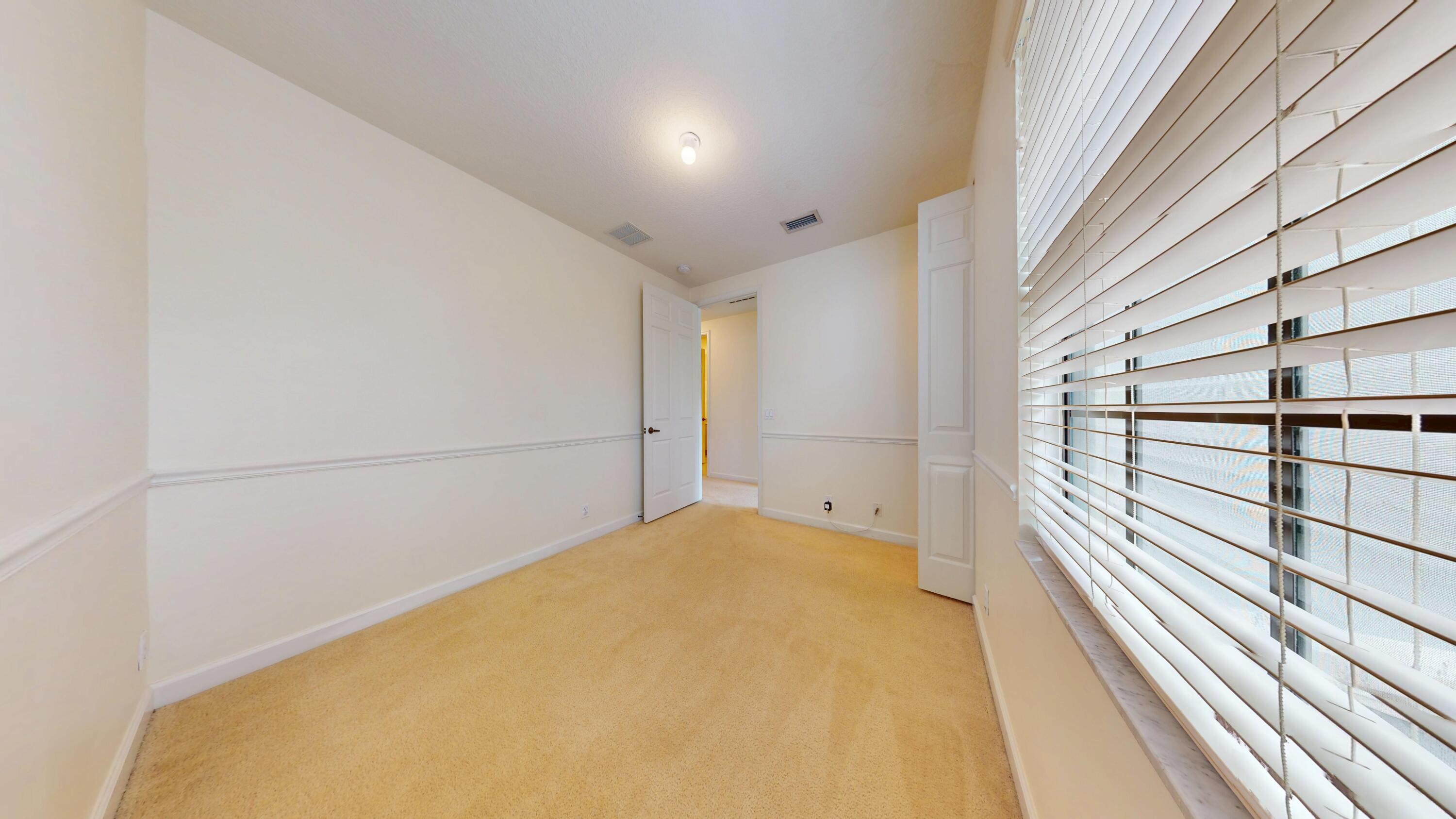 235 Chrystie Circle Delray Beach, FL 33484 - Photo 25 of 27 a view of a room with a balcony and wooden floor