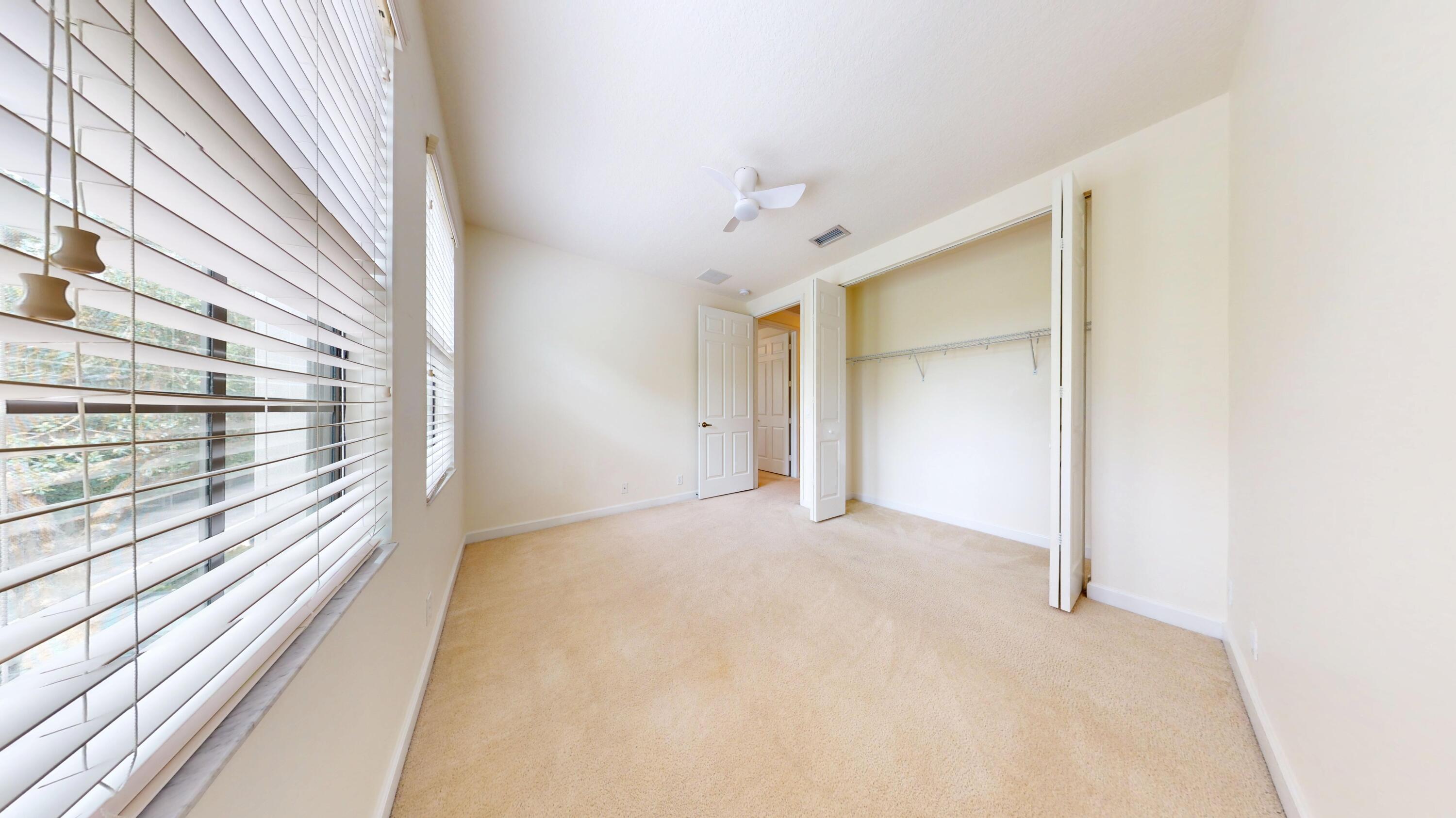 235 Chrystie Circle Delray Beach, FL 33484 - Photo 26 of 27 a view of an empty room with a window