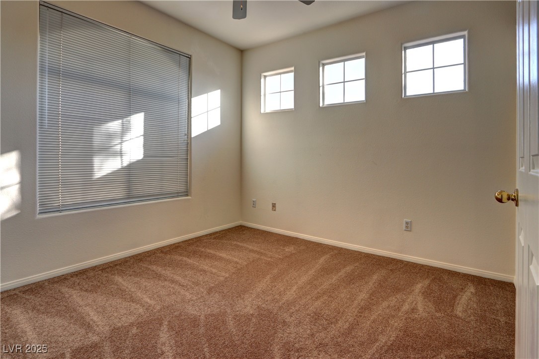 3555 Meridale Drive, Unit 2153 Las Vegas, NV 89147 - Photo 16 of 24 Empty room with carpet and a ceiling fan