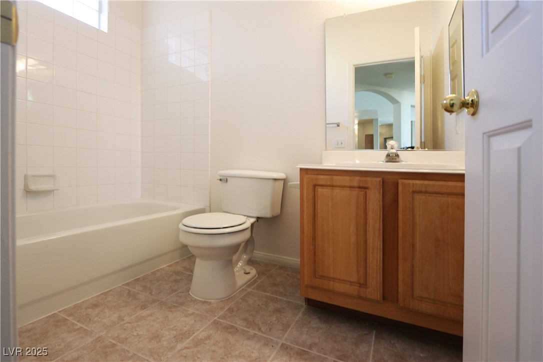 3555 Meridale Drive, Unit 2153 Las Vegas, NV 89147 - Photo 17 of 24 Full bath with vanity, light tile patterned flooring, and tub / shower combination