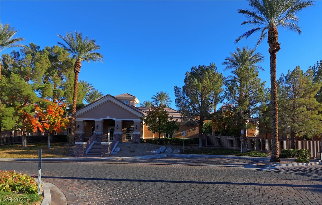 3555 Meridale Drive, Unit 2153 Las Vegas, NV 89147 - Photo 20 of 24 View of front of property featuring a fenced front yard and stucco siding