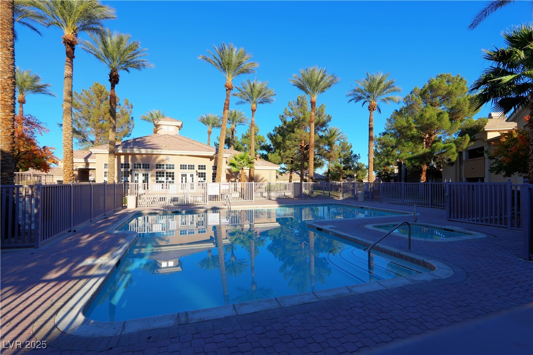 3555 Meridale Drive, Unit 2153 Las Vegas, NV 89147 - Photo 22 of 24 Community pool featuring a patio area and a hot tub