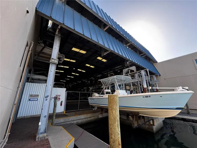 a kitchen with a sink a stove and chairs