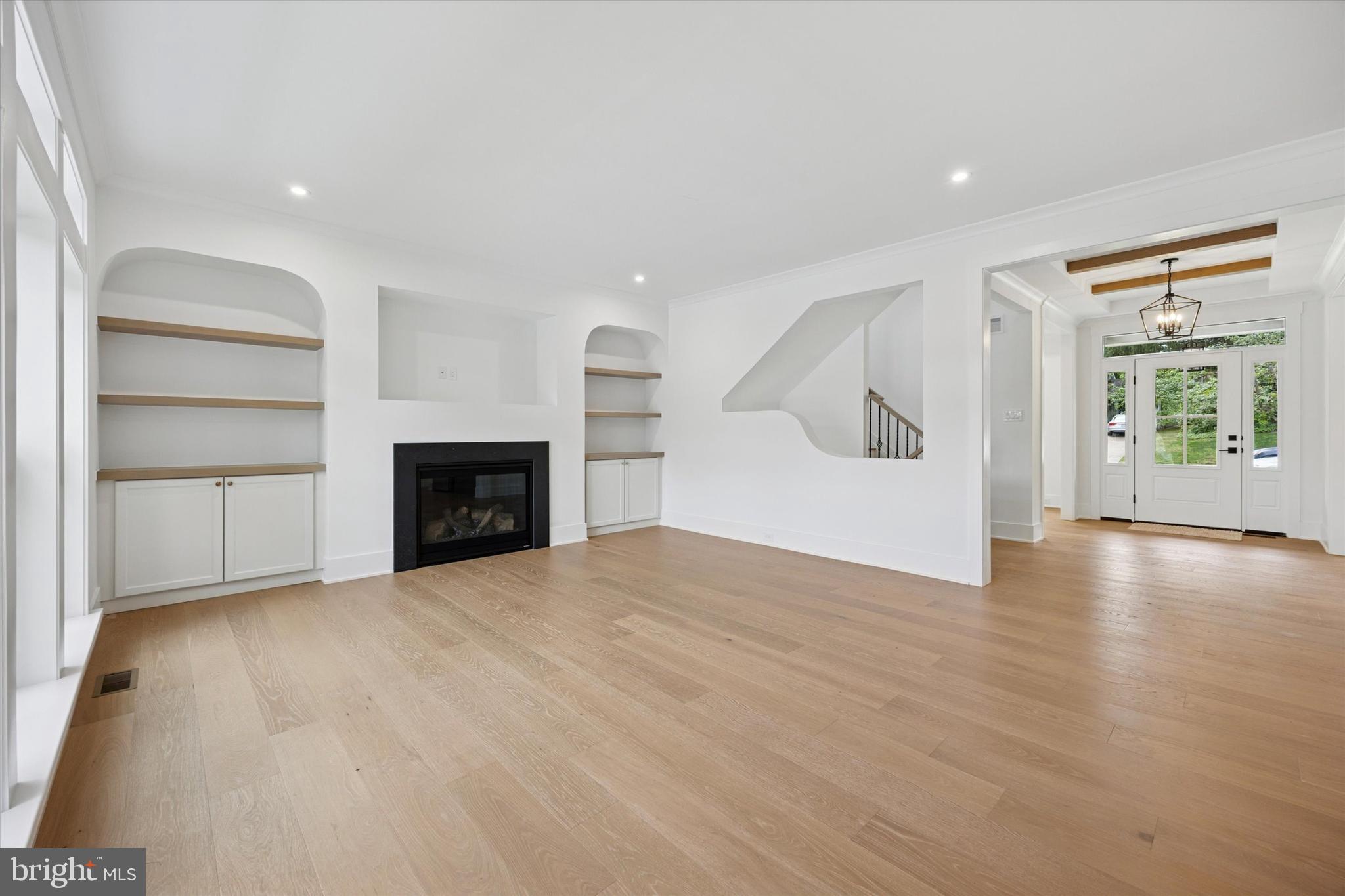 631 Pardee Lane Haddonfield, NJ 08033 - Photo 11 of 37 a view of an empty room with a fireplace and a window
