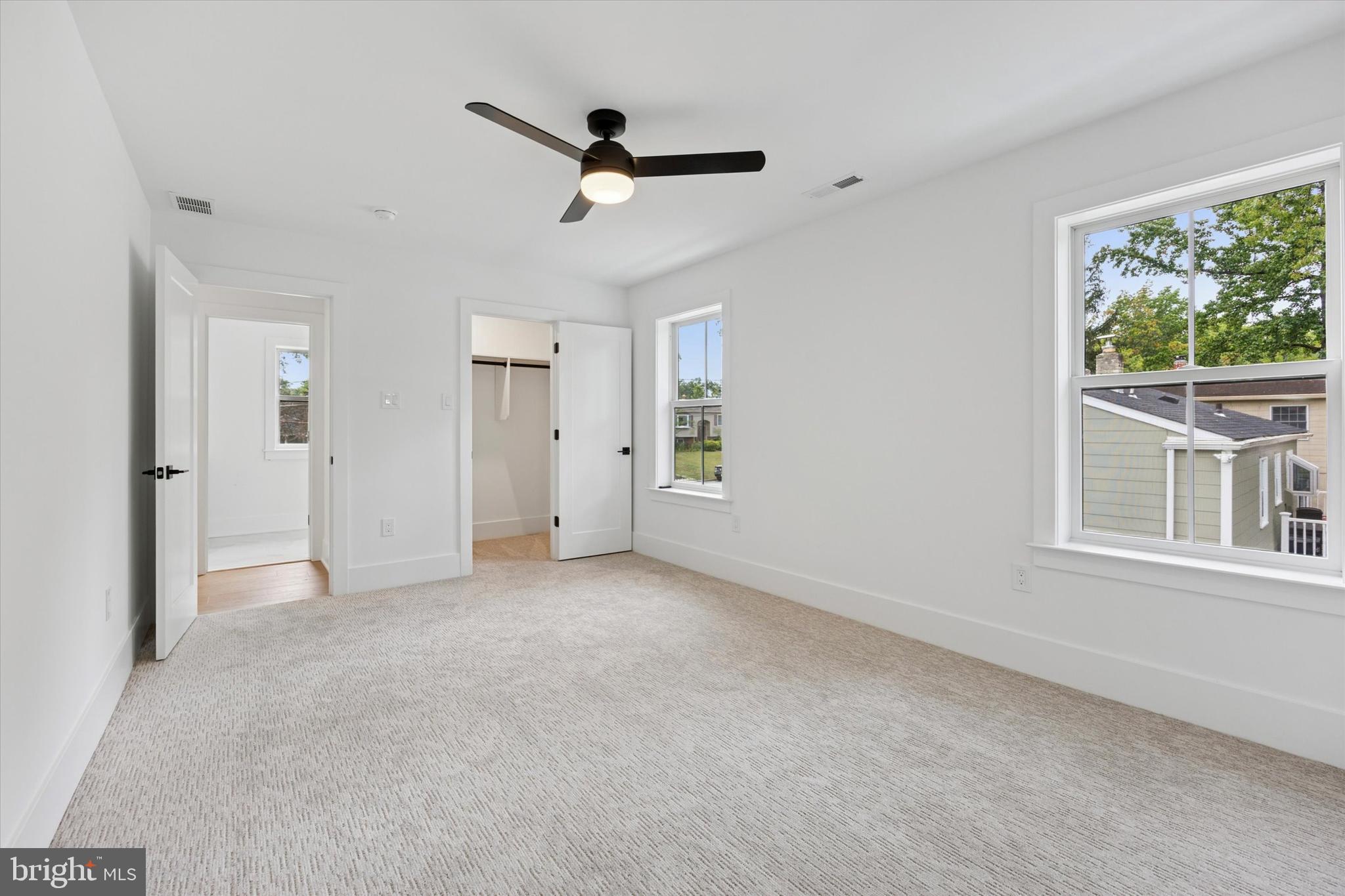 631 Pardee Lane Haddonfield, NJ 08033 - Photo 18 of 37 an empty room with a ceiling fan and windows
